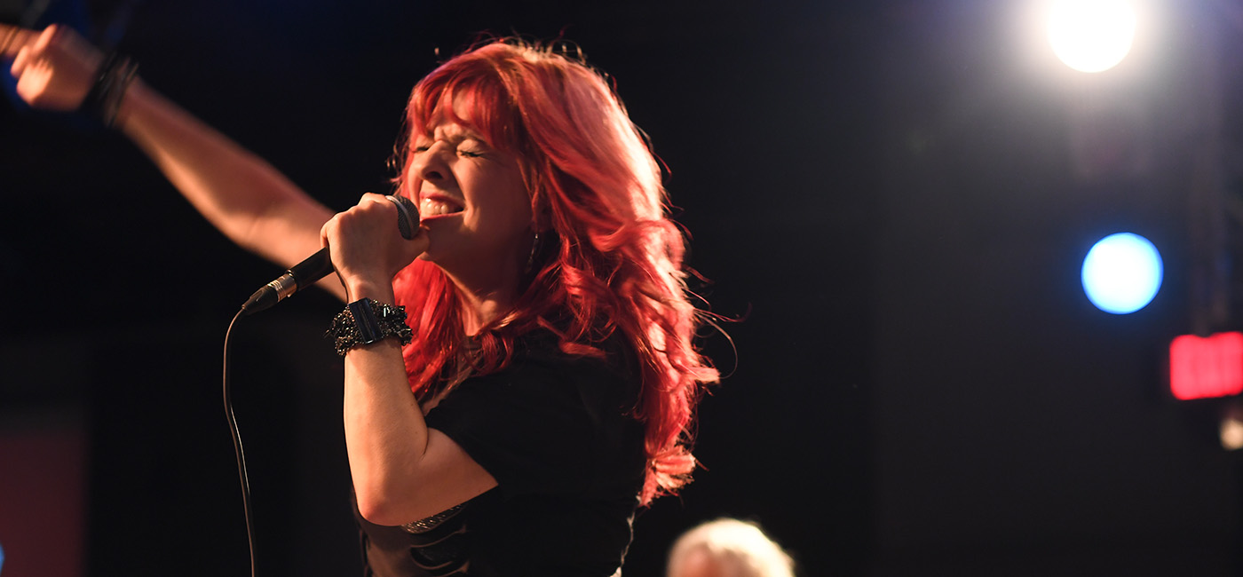 Tanya Diona singing on stage